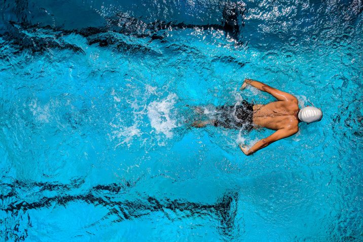 Man exercising in the pool