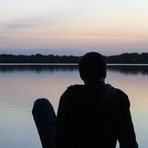 Man Looking at a Lake