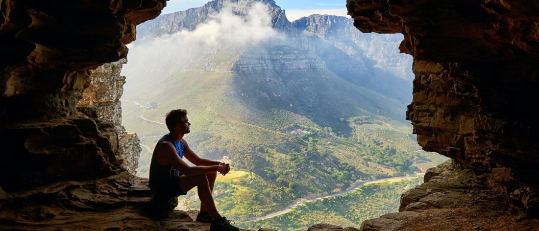 Man on mountain - choose peace