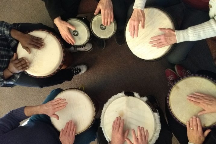People playing in a drum circle