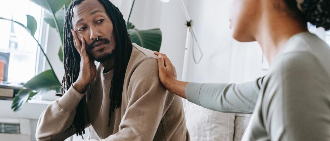 Woman with her hand on a man's shoulder - Traits of an Empath