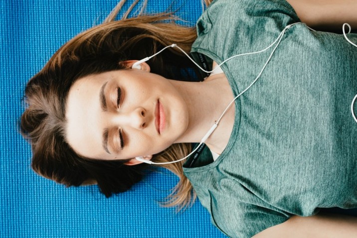 Woman laying down using guided imagery to think herself well