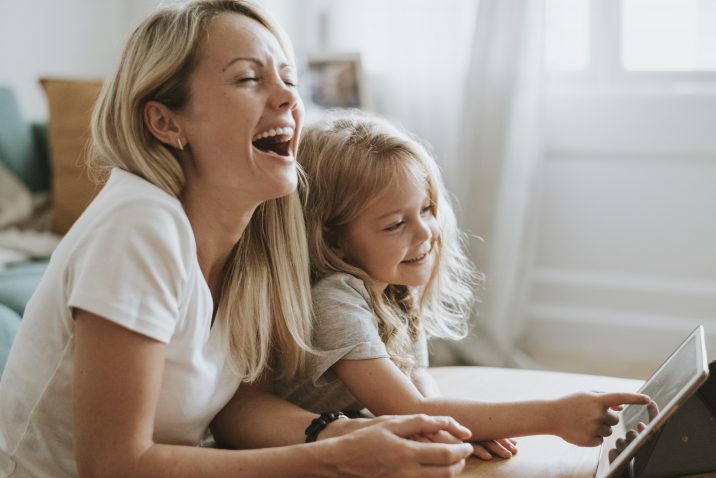 Mom and daughter laughing at life