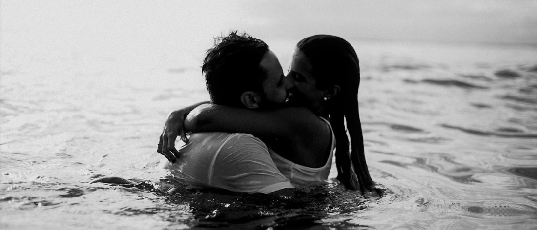 Loving couple kissing at the beach