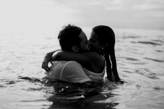 Loving couple kissing at the beach