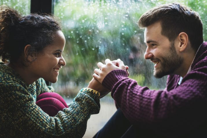 Couple talking and holding hands