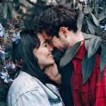 Loving couple standing under a tree