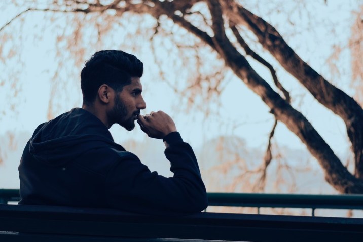 Man on bench thinking about life