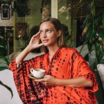 Woman daydreaming in a cafe