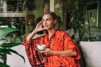 Woman daydreaming in a cafe
