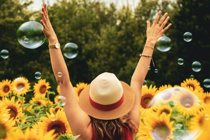 Woman in flowers living a precious life