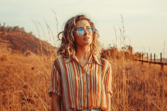 Woman with glasses viewing field